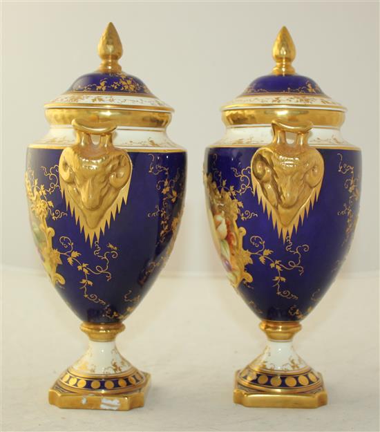 A pair of Coalport fruit painted pedestal vases and covers, post war, 24cm